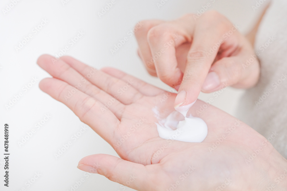 Woman applying natural cream, Woman moisturizing her hand with cosmetic cream, Spa and Manicure concept. Woman applying natural cream, Woman moisturizing her hand with cosmetic cream, Spa and Manicure concept.