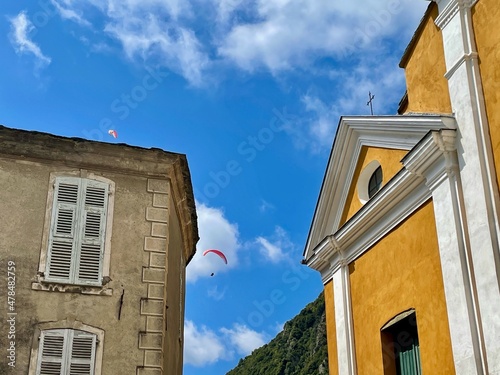 Saint Erasme cathedral on main square in Cervione, a dreamy village nestled in the mountains of Castagniccia. Corsica, France. photo