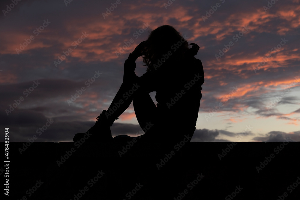 silhouette of woman with perfect body at sunset
