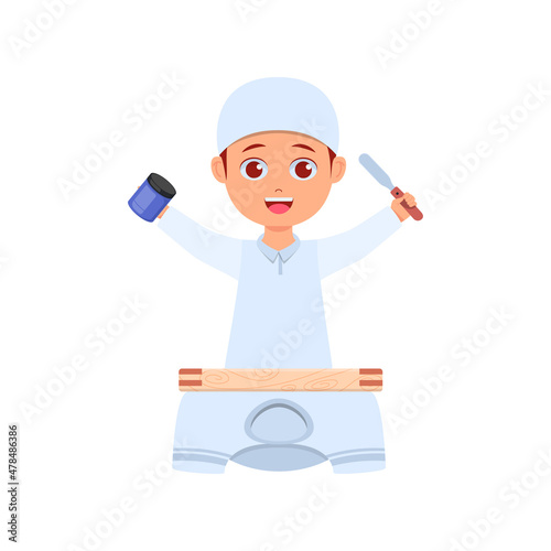 Cute boy ready to screen print clothes with ink and wood handle in hand