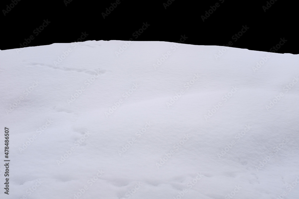 a pile of snow isolated against a black background