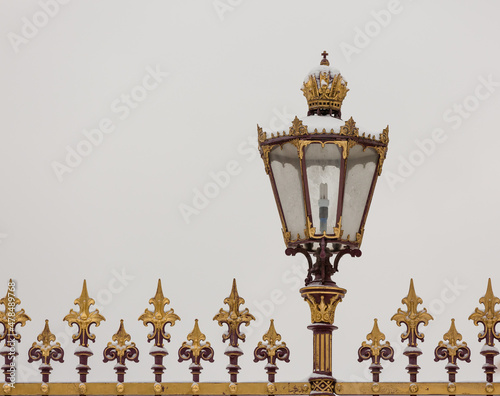 Vienna, golden details of a lamp in the imperial garden in winter