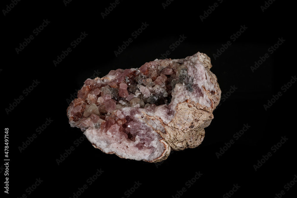 Macro mineral stone Pink Amethyst on a black background