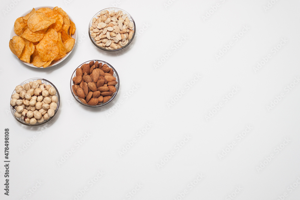Nuts and snacks, a snack for beer on a white solid background. Nuts and snacks, a snack for beer on a white solid background.