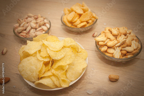 Nuts and snacks, a snack for beer on a light background.