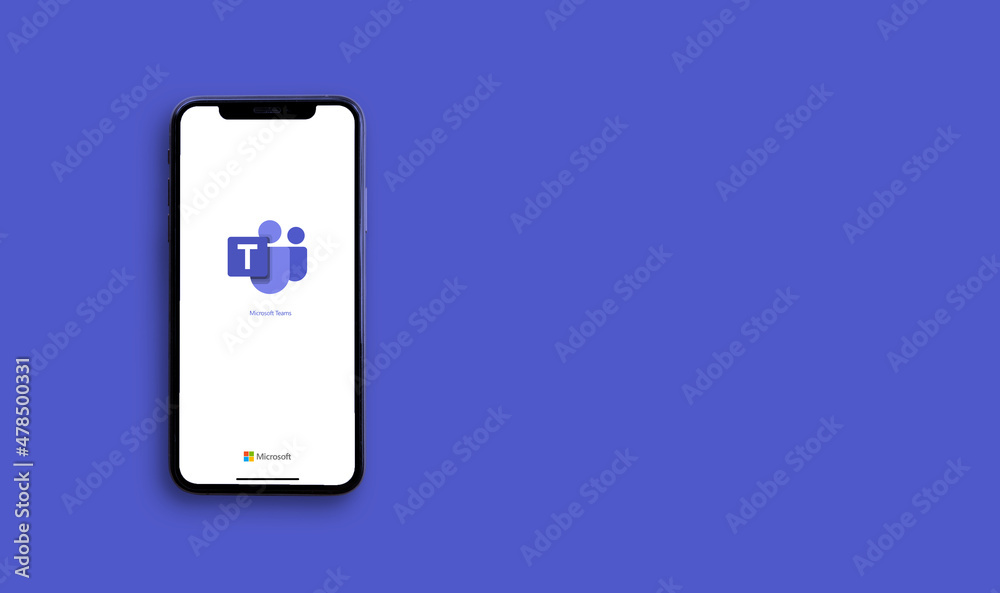 Microsoft Teams application on the smartphone screen on purple background.  Copy space. Top view : Chiang Mai, Thailand, 1 January 2022 Photos | Adobe  Stock