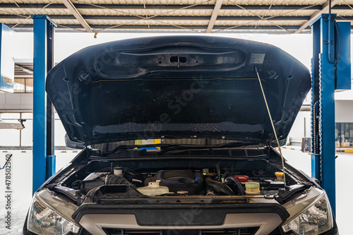 Canvastavla Pickup truck with car hood opening for maintenance the engine in the garage