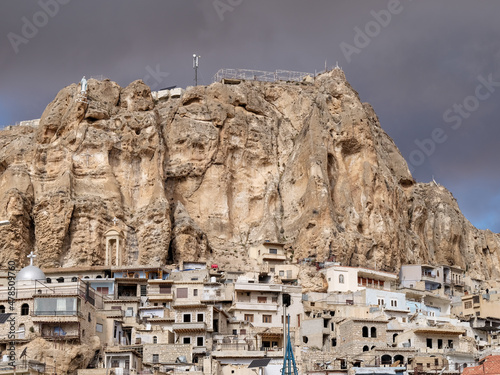 SYRIA. Maalul Monastery is located 60 km from Damascus. Nearby is the village of Kalamondin resembling an eagle's nest. The houses are built on the rocks by steps.