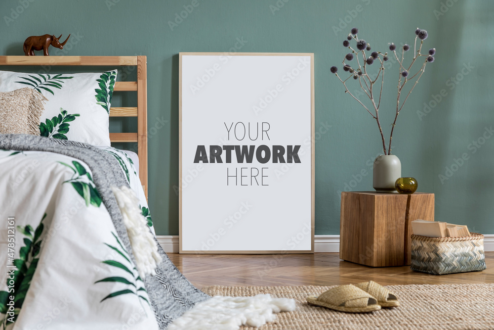 Stylish and modern sunny bedroom interior with mock up poster frame, bed, small wooden cube as night table, bedding with green leaves and carpet. Space with marine walls and wooden parquet. Template.. - obrazy, fototapety, plakaty 