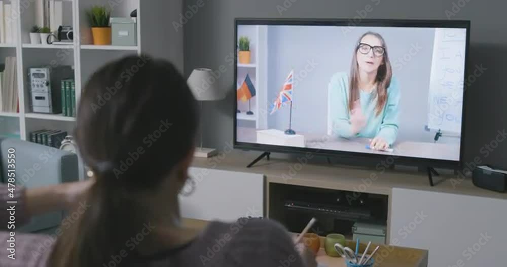 Woman learning English with TV shows Woman learning English with TV shows