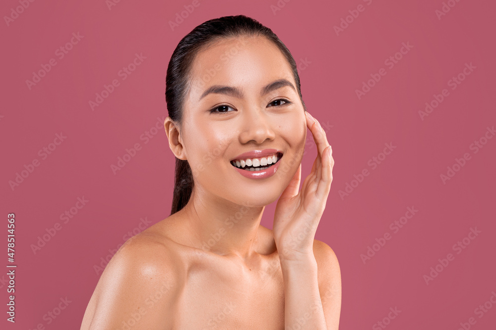 Sensual beautiful asian lady posing topless on studio background Sensual beautiful asian lady posing topless on studio background