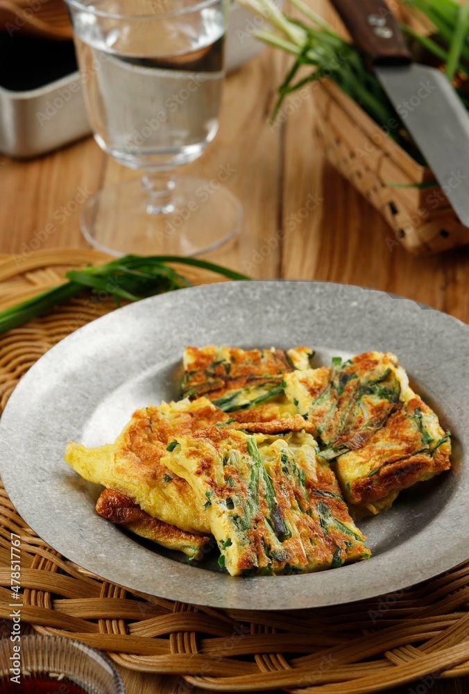Chives Pancake, Popular as Pajeon Pancake in Korea. Made from Egg, Flour, Onion, and Chives or Green Onion (Scallion). Served with Soy Suce and Sesame Seed Sprinkle Chives Pancake, Popular as Pajeon Pancake in Korea. Made from Egg, Flour, Onion, and Chives or Green Onion (Scallion). Served with Soy Suce and Sesame Seed Sprinkle
