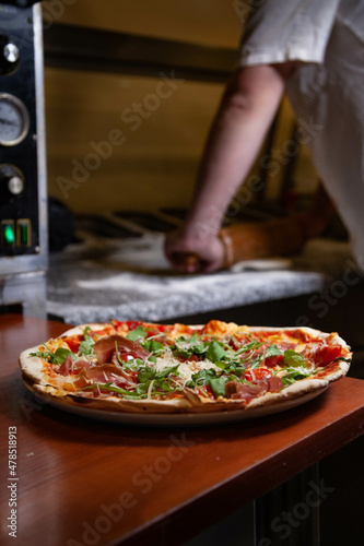 Chef, pizza chef prepares pizza for customers. preparation