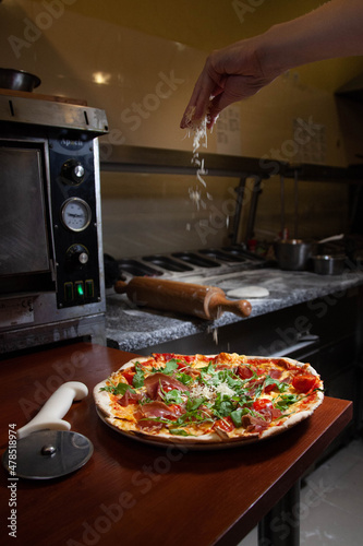 Chef, pizza chef prepares pizza for customers. preparation