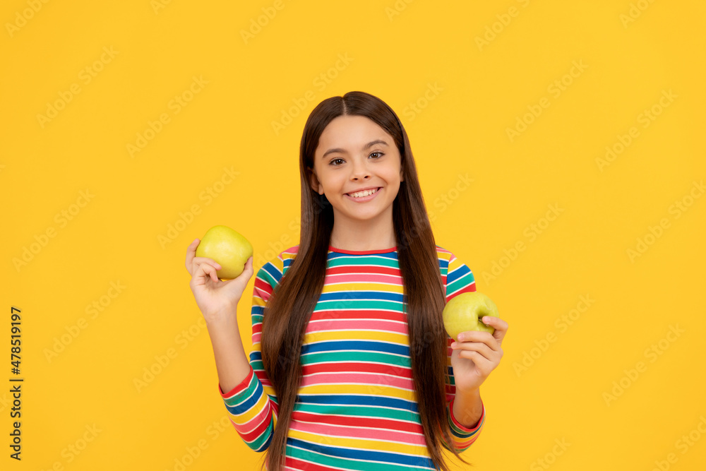 Happy girl kid hold apples yellow background, child nutrition Happy girl kid hold apples yellow background, child nutrition