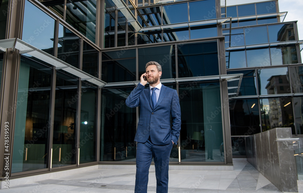 communication. businessman speak on smartphone outside the office. communication. businessman speak on smartphone outside the office.