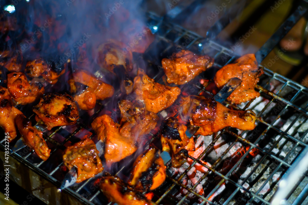 Delicious Grilled Tandoori of Assorted Meats over Charcoal and hot grill on Skewers