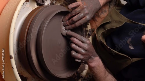 master's transformation of clay into ceramic design with artistic touches