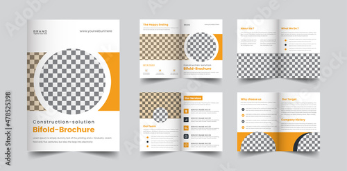 construction company 8 page brochure with geometric yellow and blue color shapes template