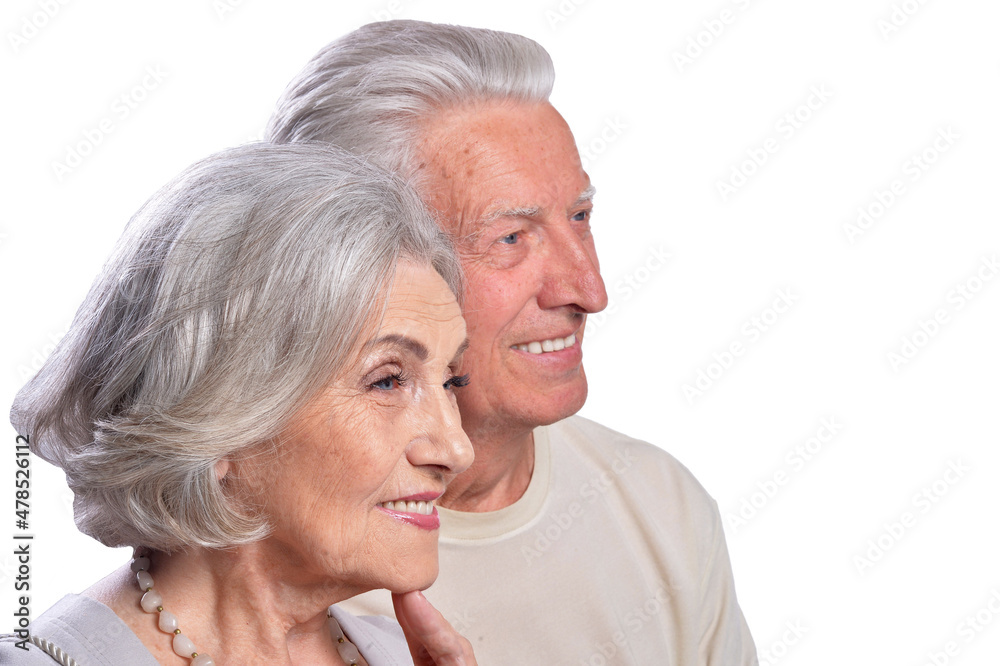 Happy senior couple embracing and posing on white background Happy senior couple embracing and posing on white background