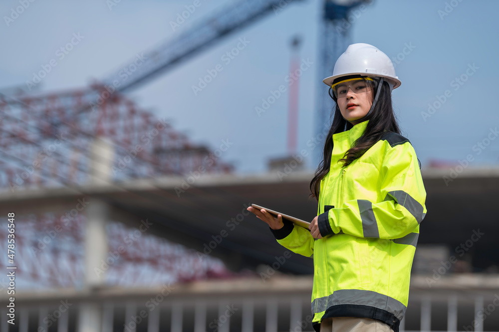 Asian engineer working at site of a large building project,Thailand people,Work overtime at construction site
