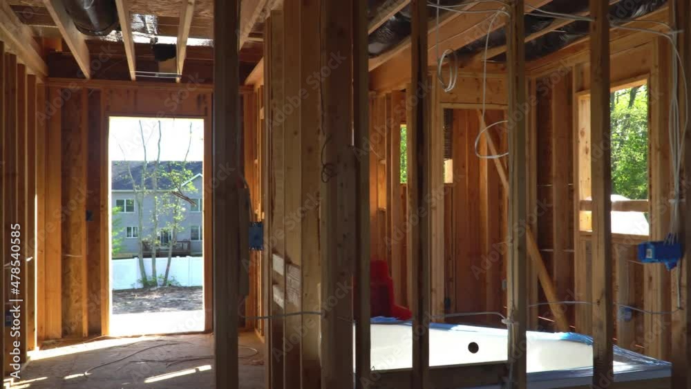Inside view of wooden beam framing under construction new development residential apartment Inside view of wooden beam framing under construction new development residential apartment