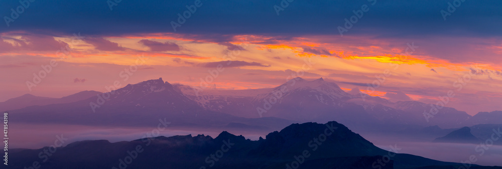 Purple sunset at the mountains. Twilight. Panoramic landscape.