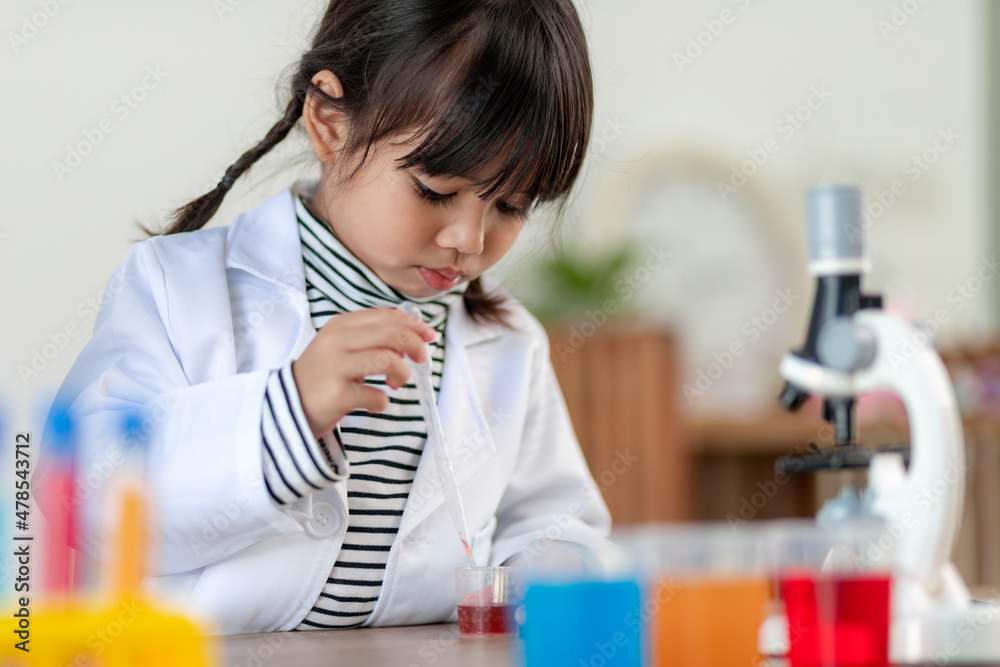 education, science, chemistry and children concept - kids or students with test tube making experiment at school laboratory education, science, chemistry and children concept - kids or students with test tube making experiment at school laboratory