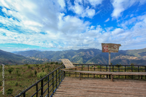 The sign at Ban Piang So Viewpoint, Bo Kluea District, Nan Province, Thailand, behind it is a mountain view. photo