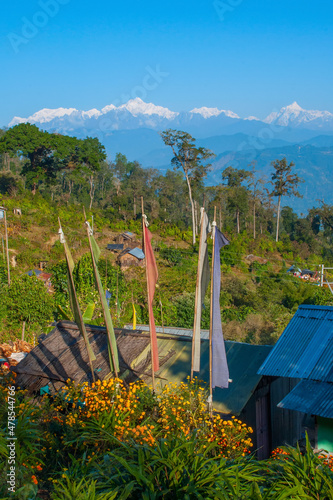 Beautiful view of Silerygaon Village with Kanchenjunga mountain range at the background, morning light, at Sikkim, India. Vertical image. photo