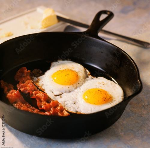 bacon and eggs in cast iron pan