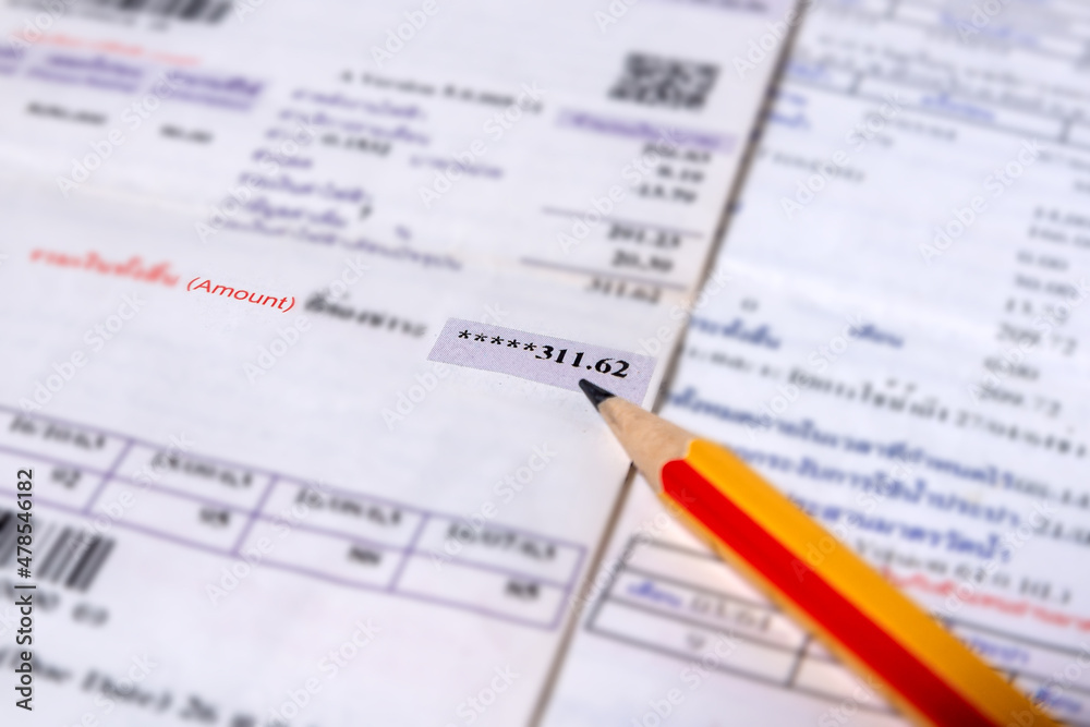 Utility energy bill with pencil blurred background Utility energy bill with pencil blurred background