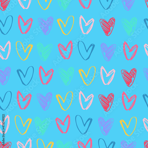 Seamless pattern with rows of hand drawn multicolored heart shapes on blue background for gift wrap and other design projects. Love, romance, Valentines Day concept © Blooming Sally