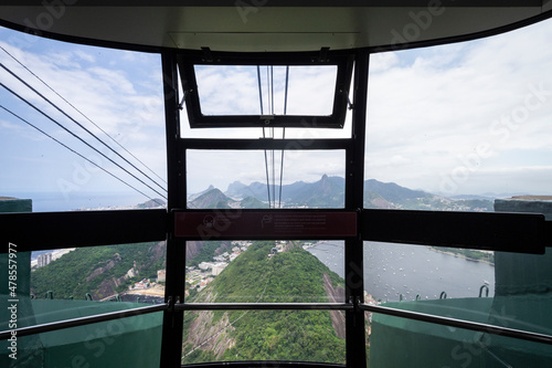 Beautiful view insideSugar Loaf cable car to ocean and green mountains photo