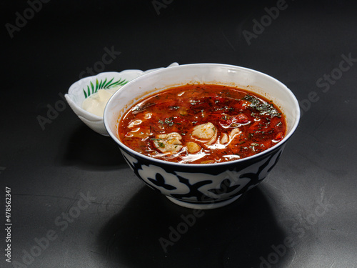 Uzbek soup - Chuchvara with dumplings photo