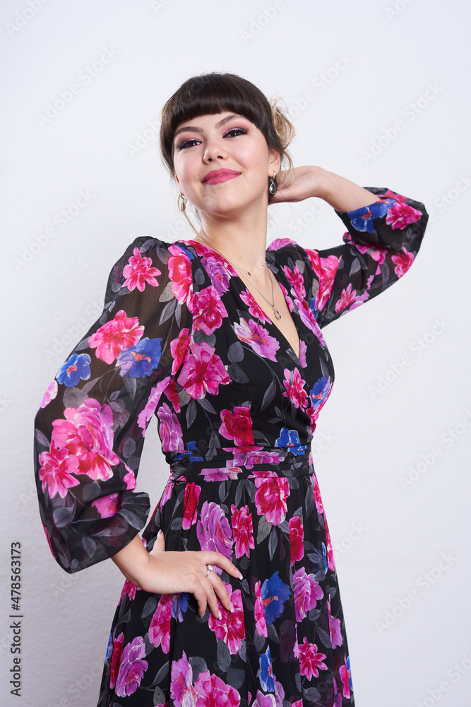 Beautiful young woman in a floral dress