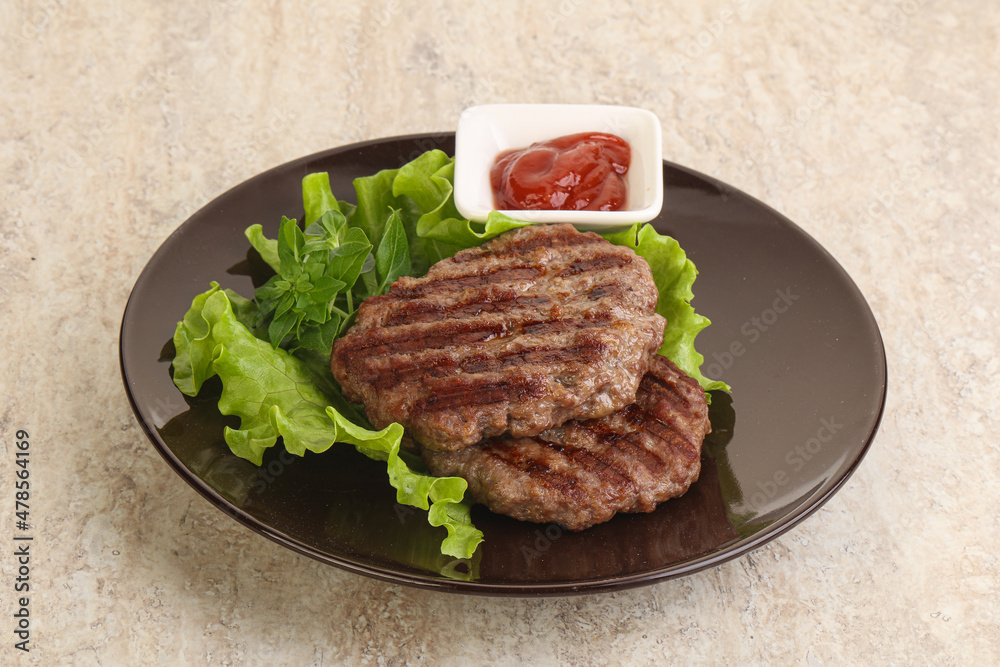 Grilled beef burger cutlet with sauce Grilled beef burger cutlet with sauce