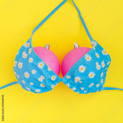 Wallpaper Mural Creative New year concept with Christmas ball ornaments and swimsuit or bikini on yellow background Torontodigital.ca