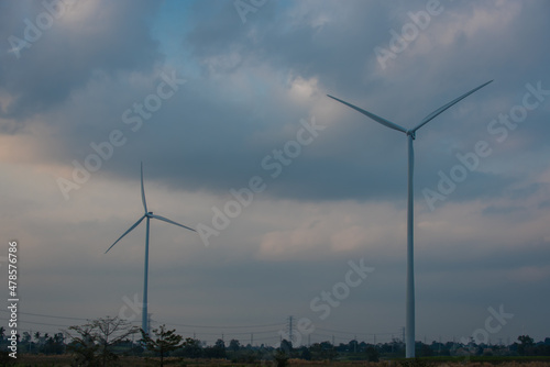 wind turbines in the field. Wind Turbines generating electricity on blue sky © VIEWFOTO STUDIO