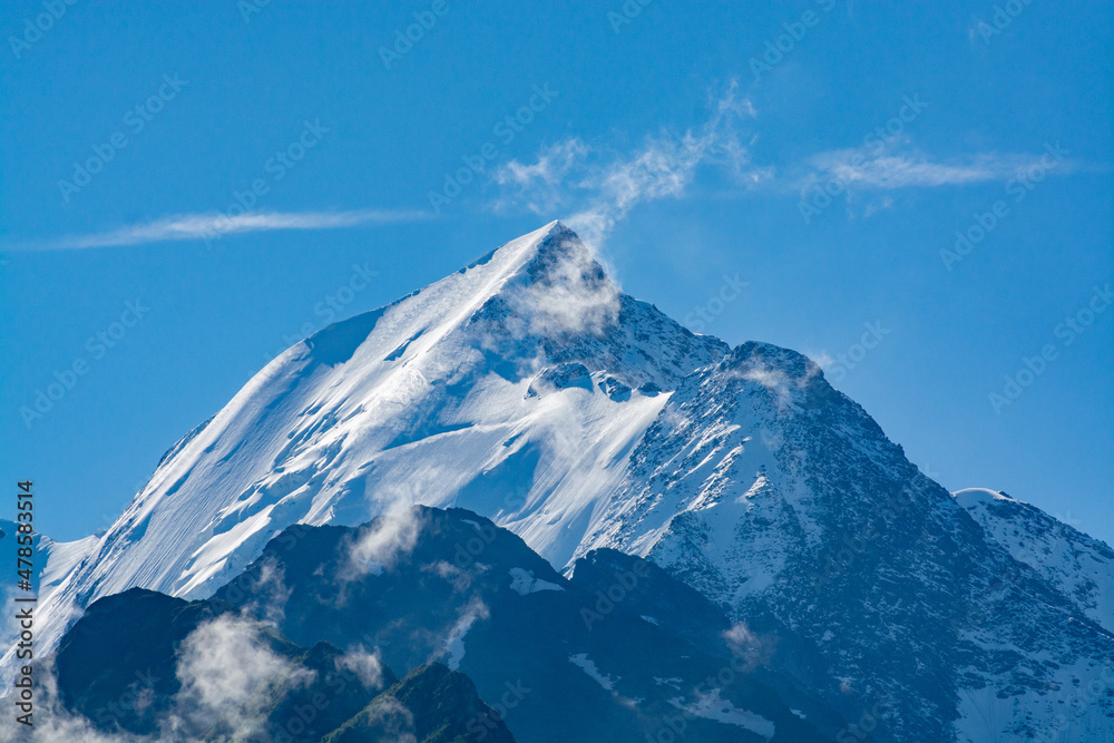 View from Saint-Gervais-les-Bains to white top of Mont Blanc mountaine range in summer