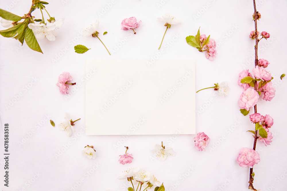 Spring white and pink flowers and stationery card. Romantic, wedding, birthday, invitation, mother's day mock up card concept. Copy space