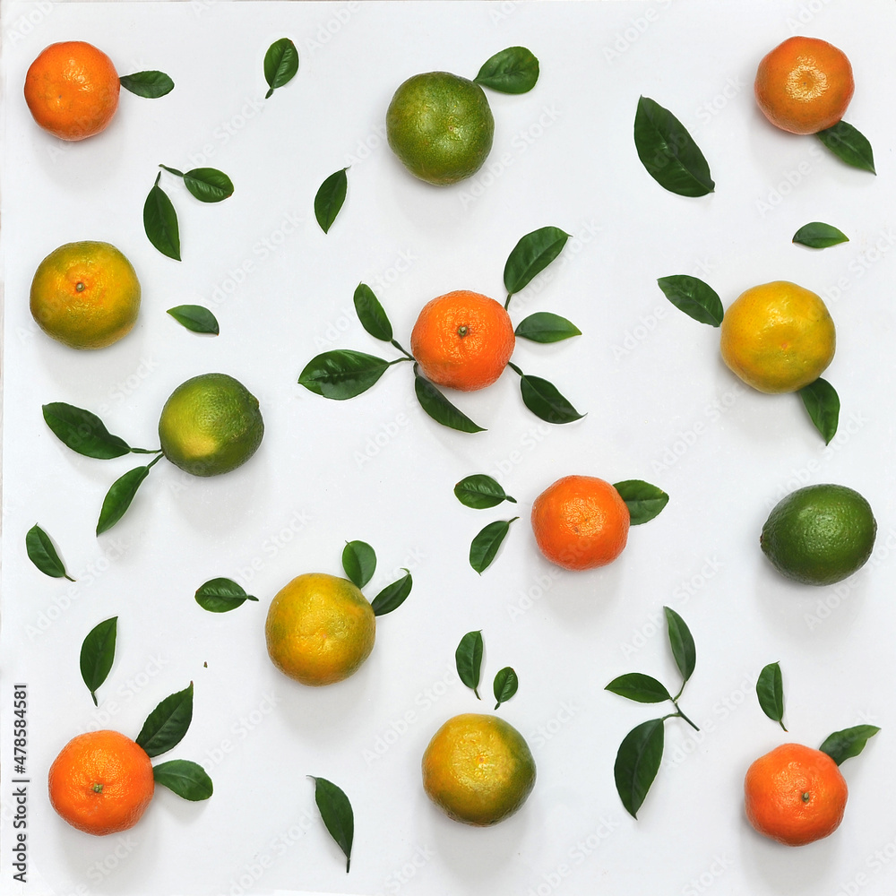 Obraz premium citrus background from fresh mandarins and limes flat lay top view
