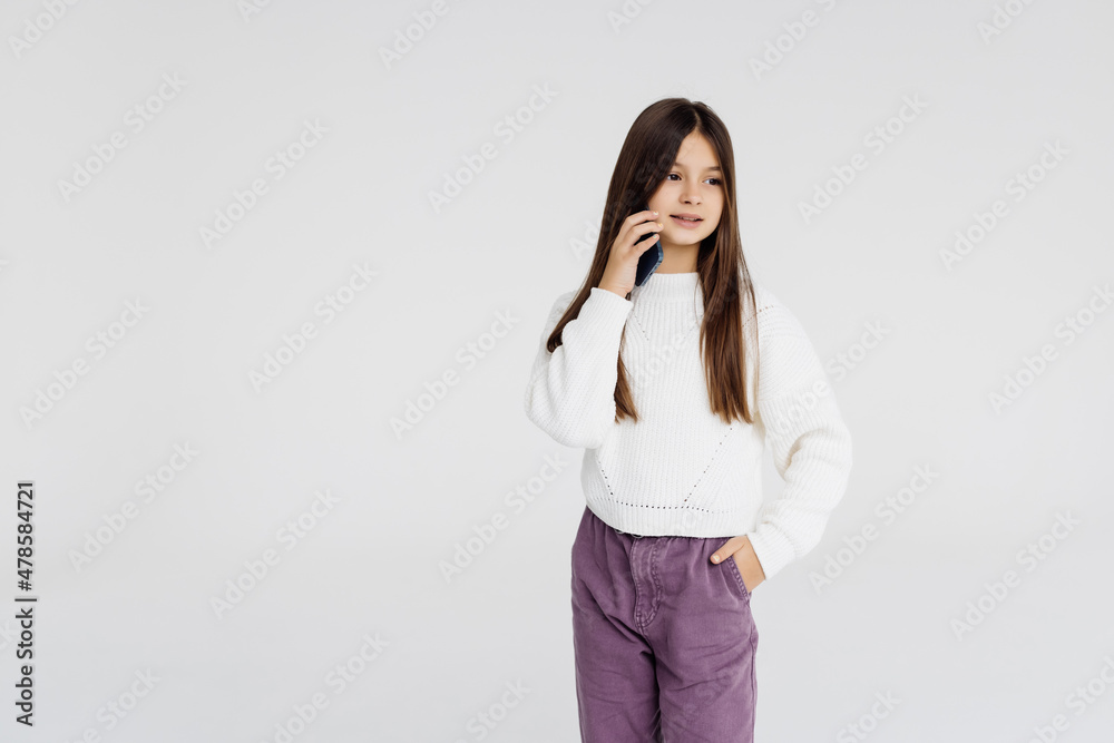 little girl with cellphone on white background little girl with cellphone on white background