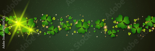 St.Patrick's Day vector banner template. Green background with colorful clover leaves
