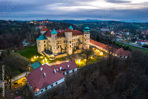 Nowy Wisnicz Castle Illuminated at Christmas Festive, Poland. Drone View