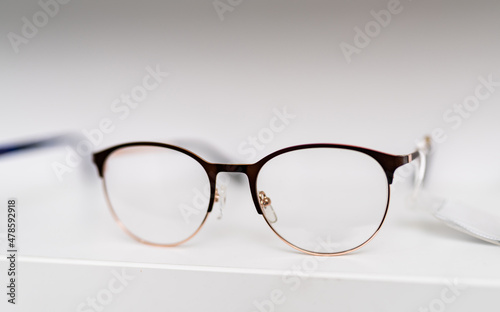 Corrective eyesight lenses. Close up of eyeglasses on the table. Stock photo