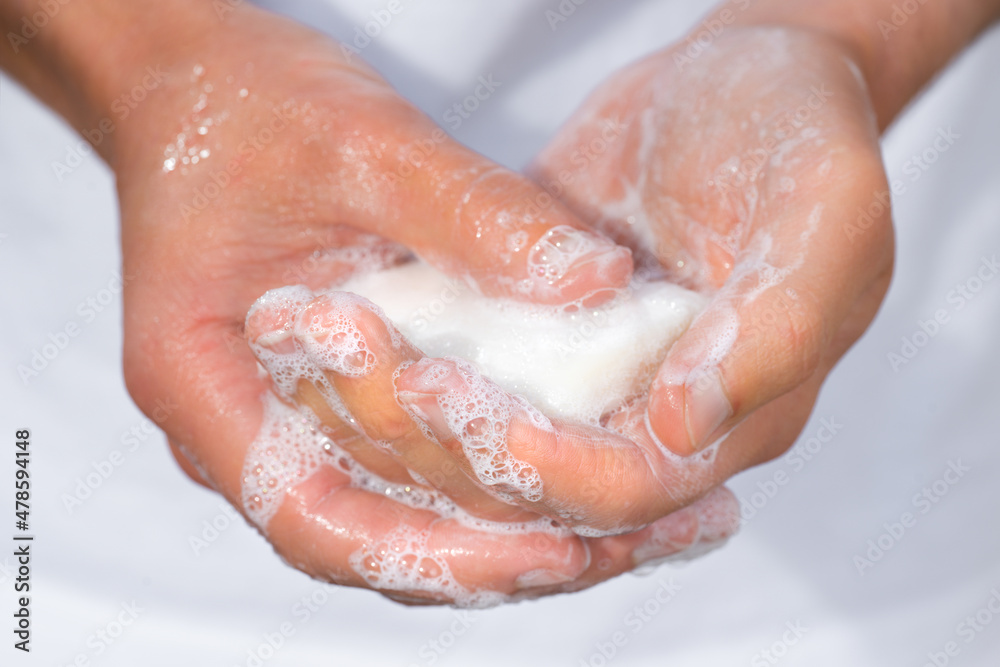 Closeup of man washing hands with soap Closeup of man washing hands with soap