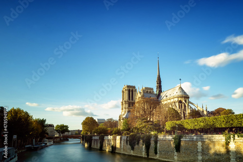 Long exposure of Cathedral Notre Dame before it burned down, during daylight from lower bank of Seine River. 