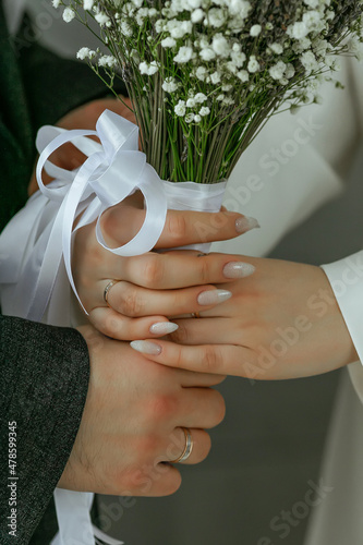 Canvas bride and groom holding hands