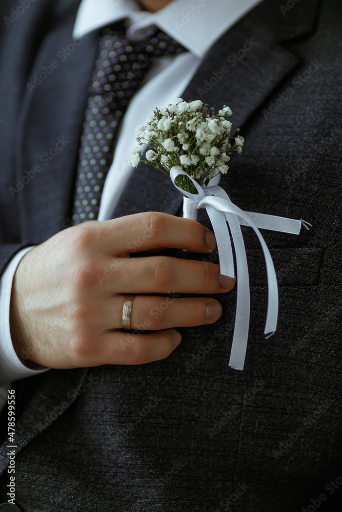 groom holding wedding bouquet groom holding wedding bouquet